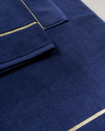 Navy Blue Chateau Turkish cotton bath mat, close-up of the gold dobby border and soft terry pile 