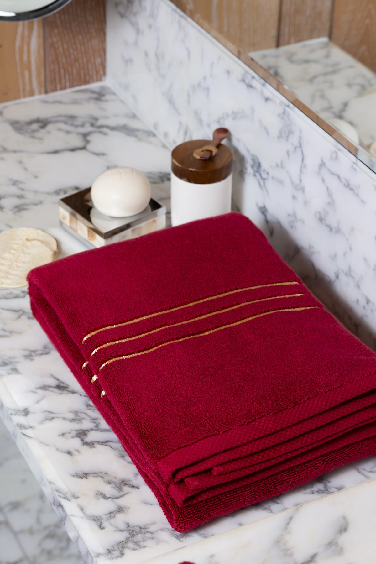 Maroon Chateau Turkish cotton bath sheet, on a marble vanity 