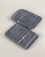 Grey Chateau Turkish cotton face towel, pair folded on a soft studio backdrop 