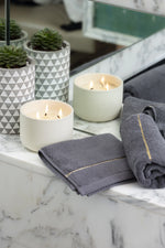 Grey Chateau Turkish cotton face towel, on a marble vanity 