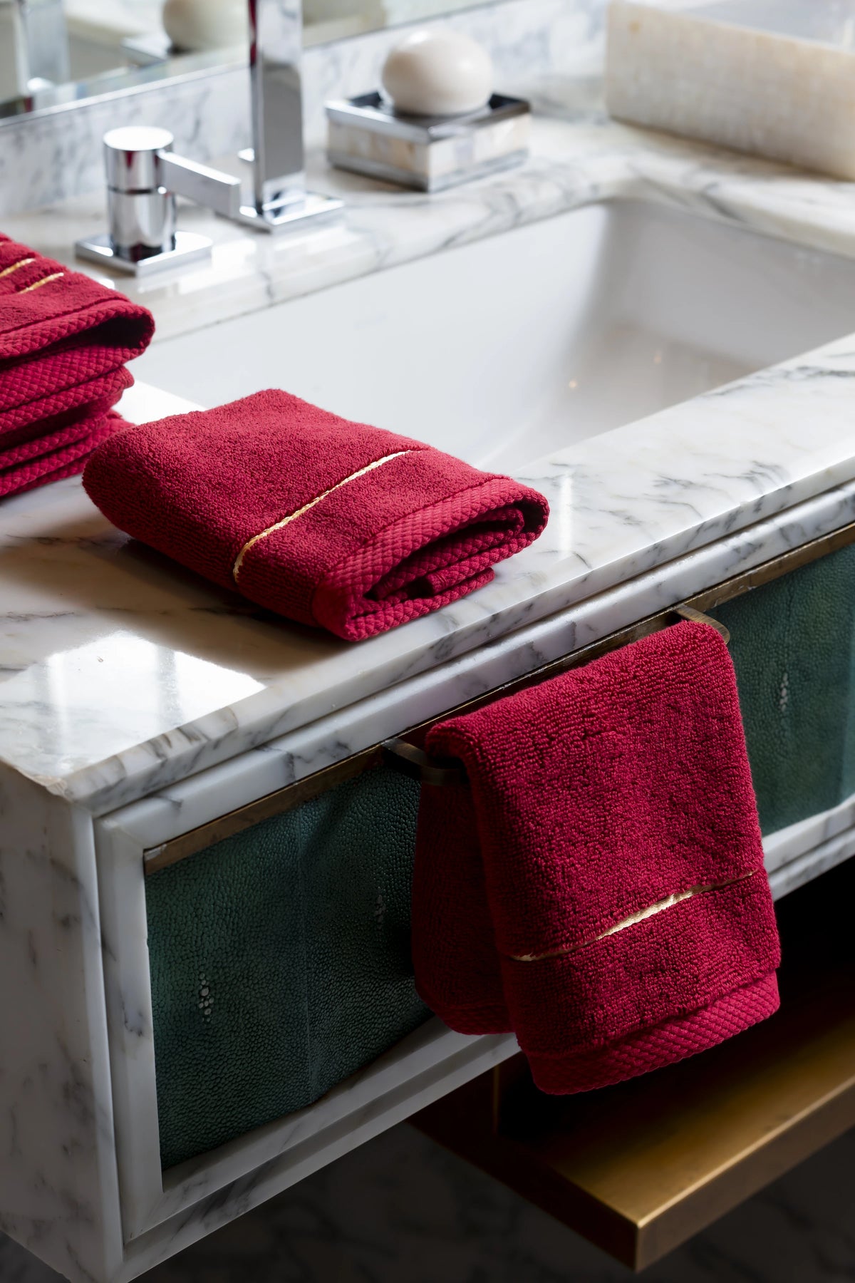 Maroon Chateau Turkish cotton face towel, on a marble vanity 