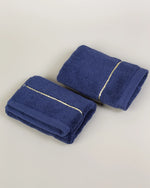 Navy Blue Chateau Turkish cotton face towel, pair folded on a soft studio backdrop 