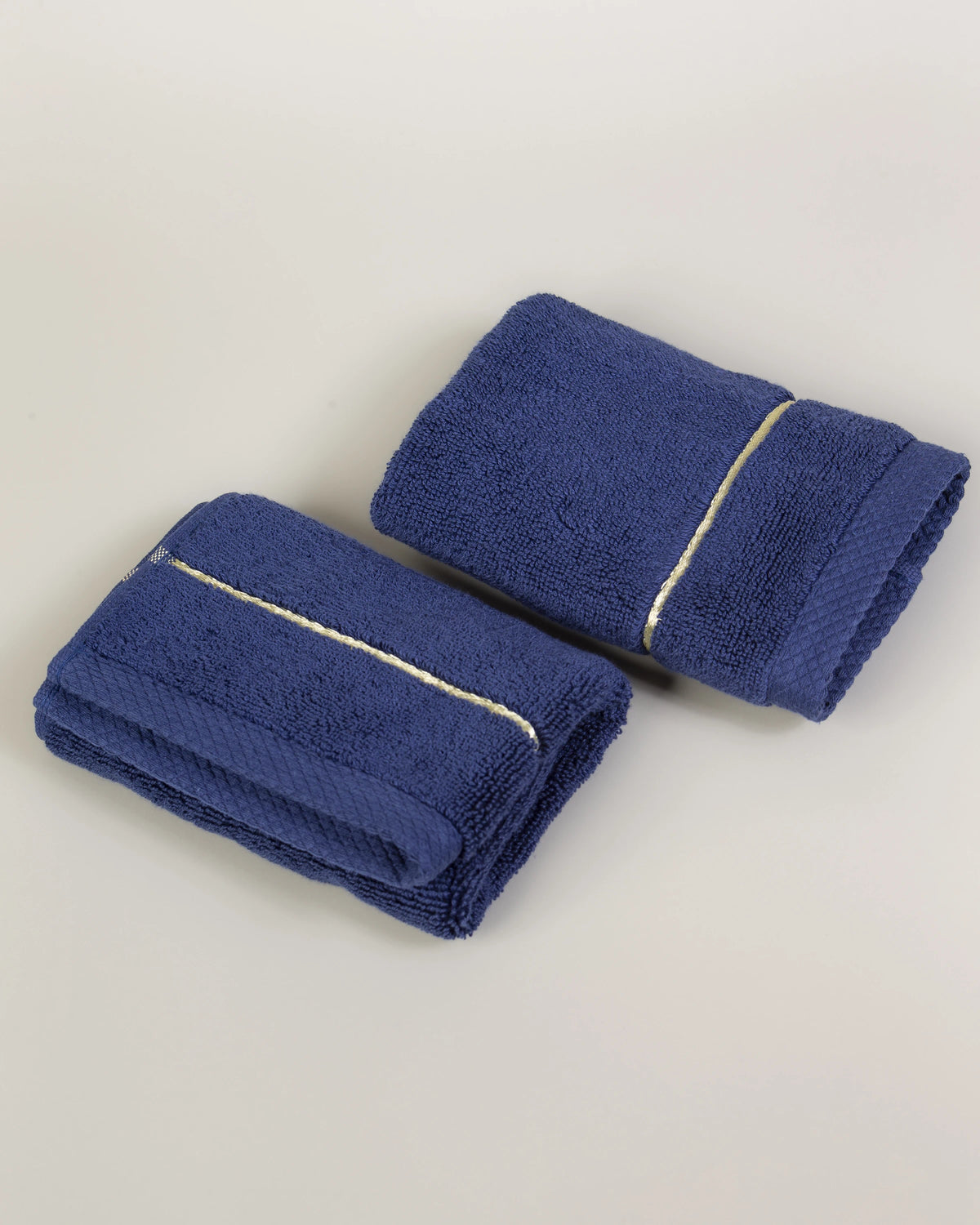 Navy Blue Chateau Turkish cotton face towel, pair folded on a soft studio backdrop 