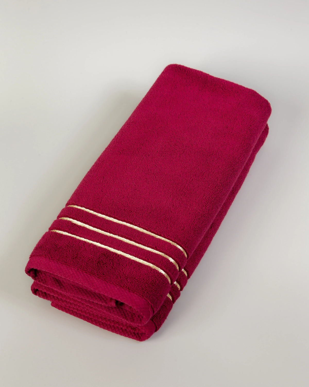 Maroon Chateau Turkish cotton hand towel, folded on a soft studio backdrop 