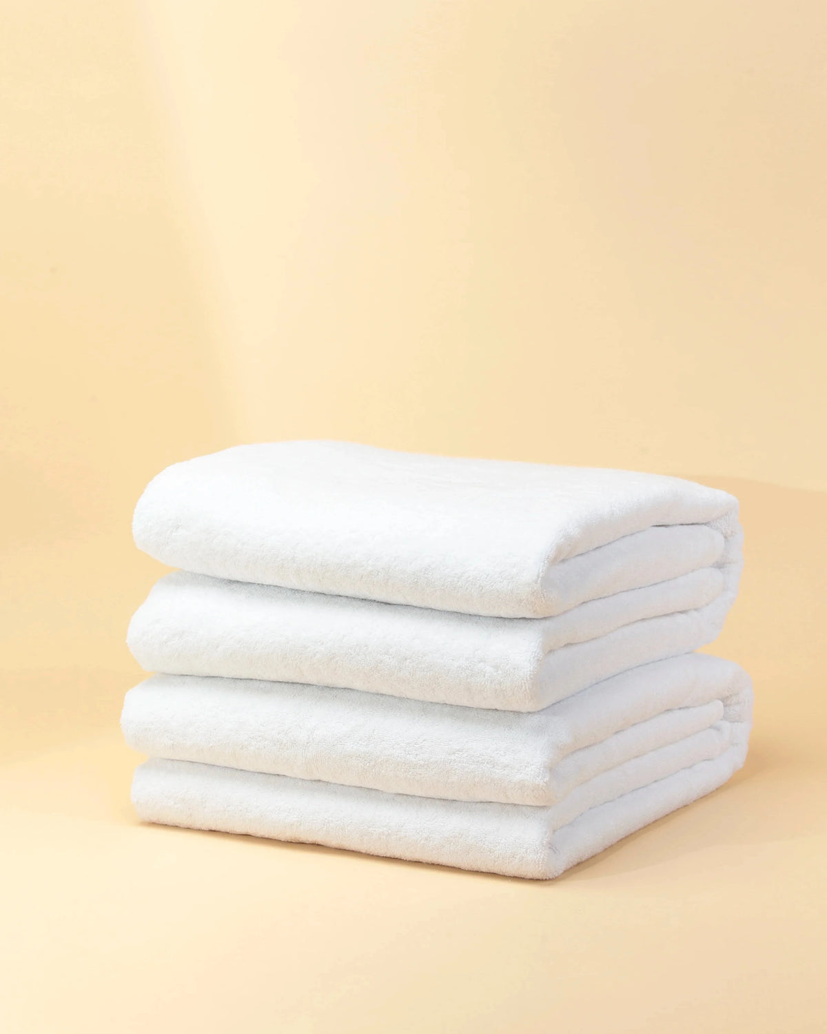 Maison 1952 Retreat bath towel in white, 650 GSM 100% cotton, stack of four folded towels