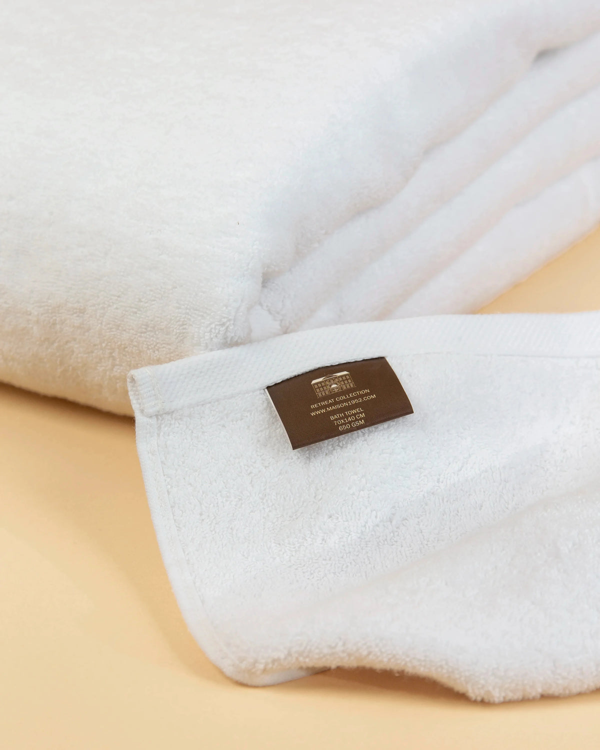 Close-up of the flat twill hem on a Retreat white cotton bath towel