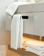 Retreat Complete Set white cotton bath towel draped over a marble vanity