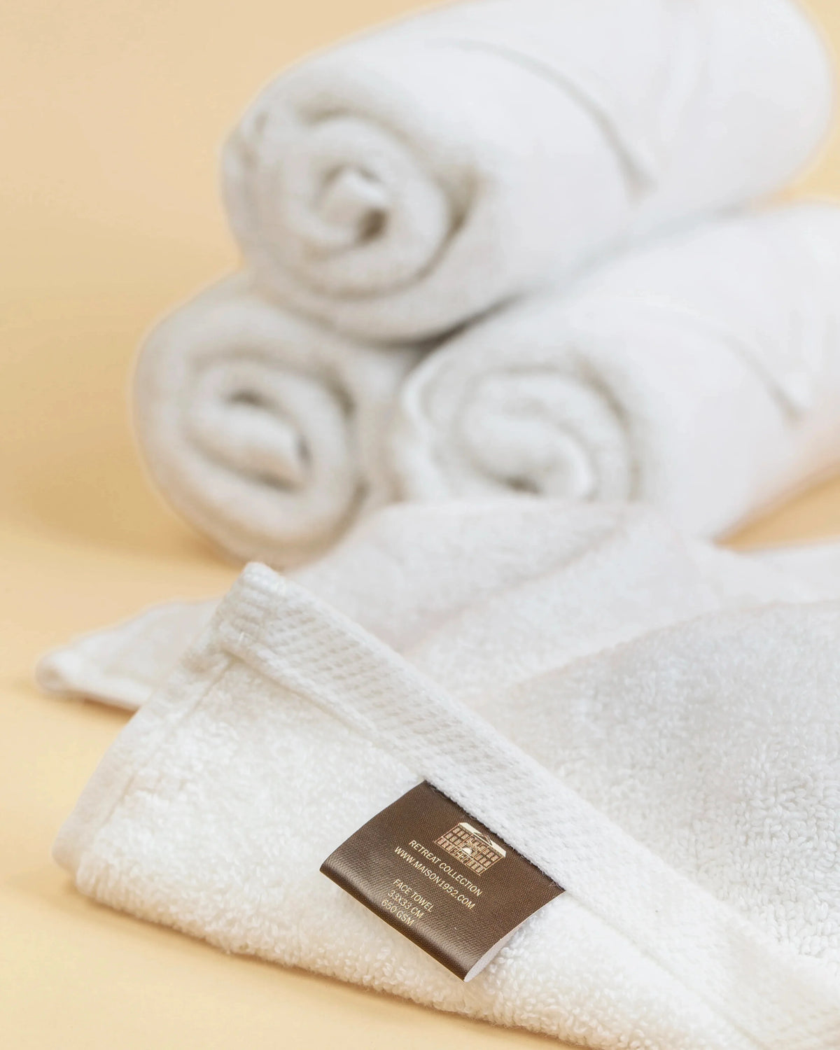 Maison 1952 Retreat face towel in white, 650 GSM 100% cotton, rolled