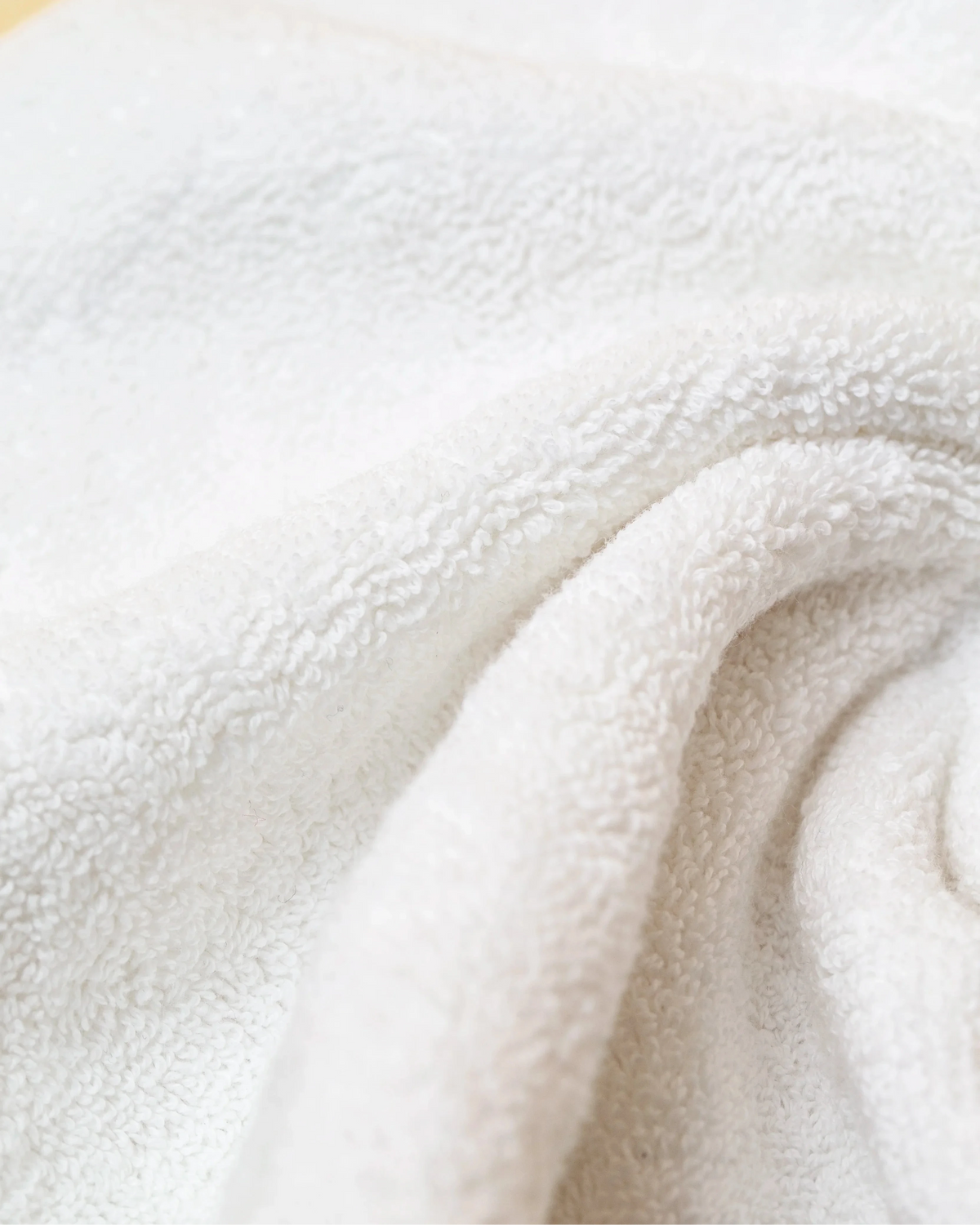 Macro detail of Retreat face towel soft 650 GSM cotton terry weave in white