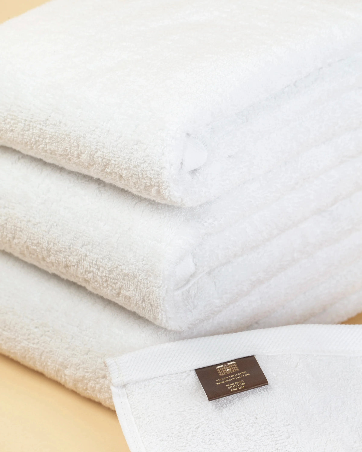Close-up of the flat twill hem on a Retreat white cotton hand towel